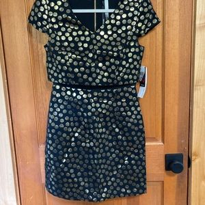 Gold polka dot cocktail dress. Has mesh detail on the midriff.